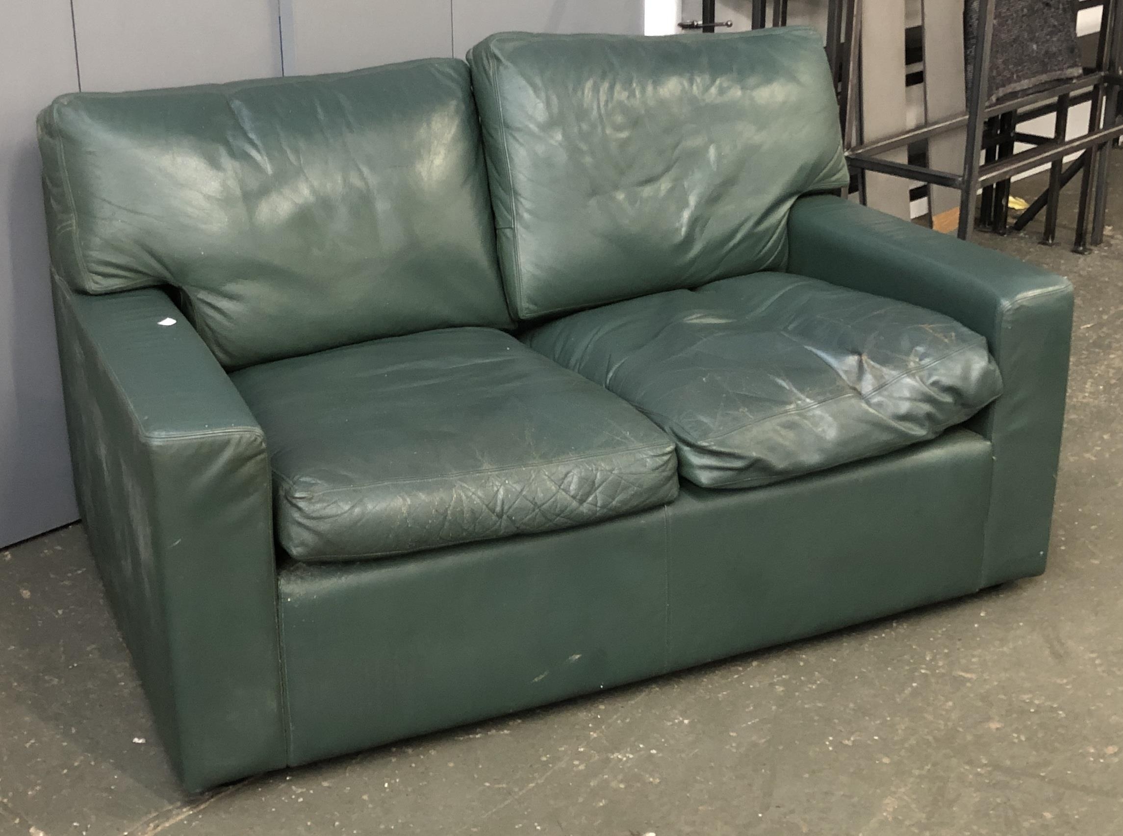 A green leather two seater, 140cmW