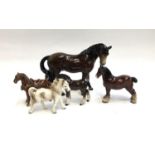 A Beswick foal, together with four other ceramic horse figures