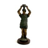 A patinated bronze candlestick in the form of a Roman centurion, 37cmH
