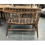 A spindle turned beechwood cradle, on stand, 107cmW