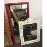 A small rectangular wall mirror in a red stained frame, 60x28cm; together with one other in an