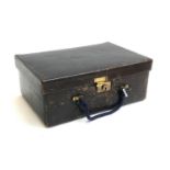 A leather gent's vanity case, the fitted interior containing various pots, brushes, and tweezers,