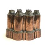A Victorian copper jelly mould, 18cmL