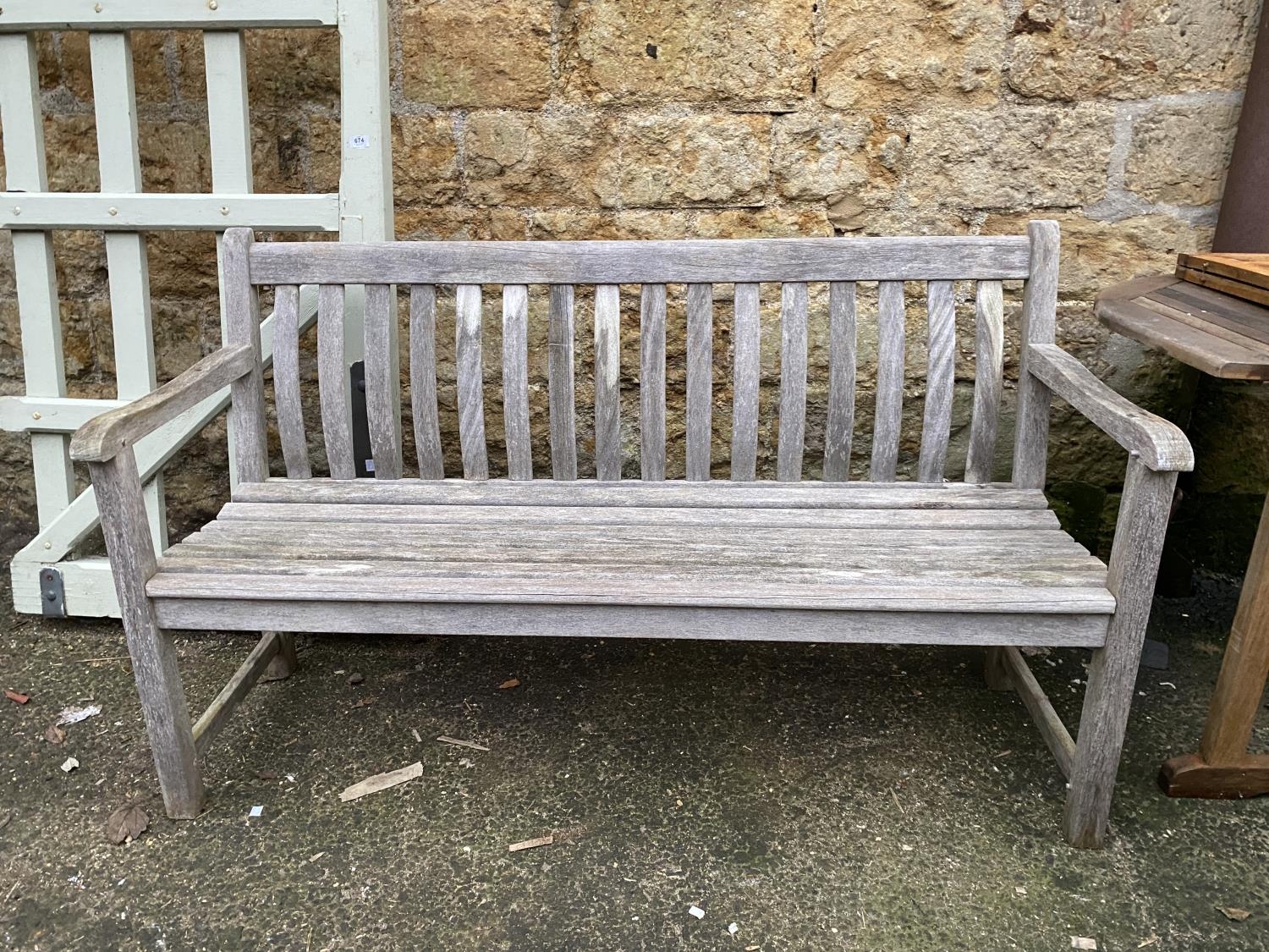 A slatted garden bench, 146cmW