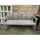 A slatted garden bench, 146cmW