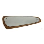 A mid century shaped teak mirror, approx. 77cmL