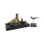 A Greek brass figure group of two doves, together with one other (2)