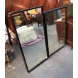 Two probably Victorian shop mirrors, rectangular, in black painted frames, 56x118cm and 66x108cmH