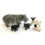 A Melba hippo figurine, 20cmL; together with an unmarked sheep and lamb figurine; and two ebony