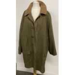 A Wright & Peel tweed shooting jacket, 42in chest with wool lining, button front