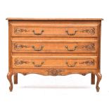 A modern oak continental style chest of three drawers, on cabriole legs, 105x48x81cmH