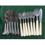 A set of six silver bone handled fruit forks, by Viner's, with matching serving fork and knive,