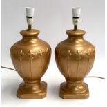 Interior design interest, A pair of Allders gold painted ceramic table lamps, with fleur de lis
