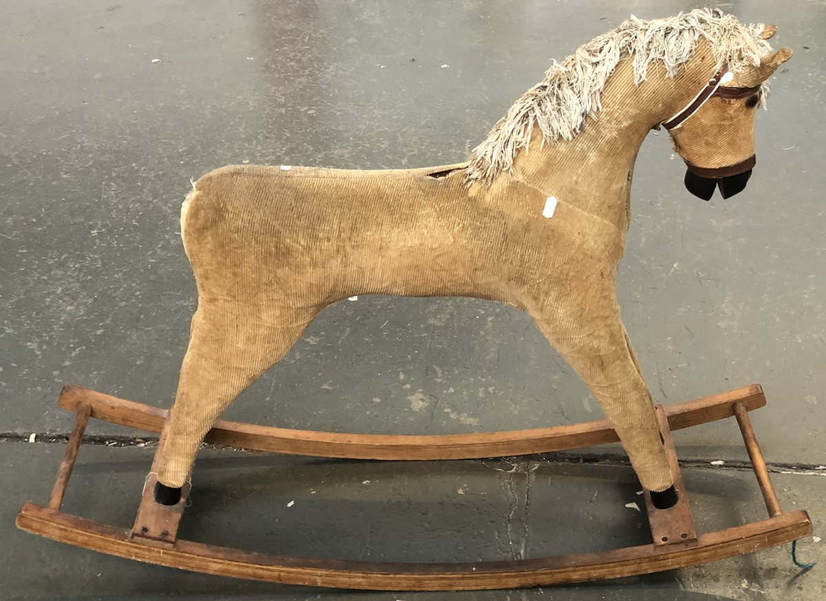 A brown corduroy rocking horse, 105cmL