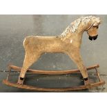 A brown corduroy rocking horse, 105cmL