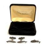 A pair of Ola Gorie silver fish cufflinks; together with a matching brooch, in an Ola Gorie box