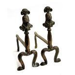 Two pairs of brass fire dogs, one set formed as reeded columns with orb finials, the other capped