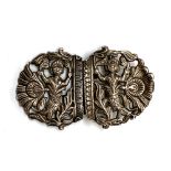An unusual Eastern white metal buckle, of pierced form depicting mermaids and peacock feathers, 9.