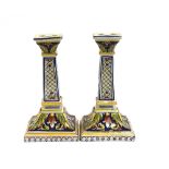 A pair of Italian majolica candlestick holders (af), marked to base, 21cmH