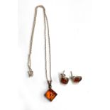 A silver and amber necklace; together with a pair of matching stud earrings