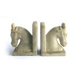 A pair of alabaster bookends in the form of horse heads, 17.5cmH