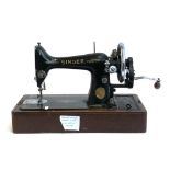 A vintage sewing machine, s/n EA122976