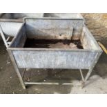 A galvanised metal water trough/manger, 94x63x85cmH