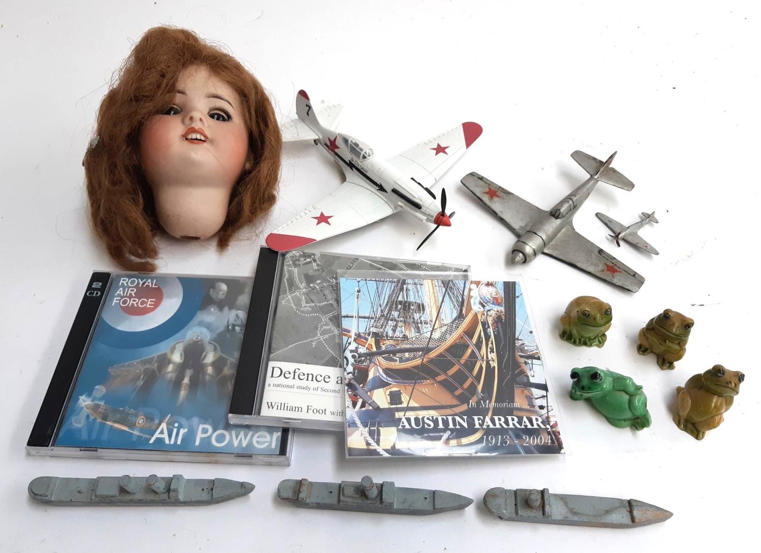 A mixed lot to include an S.F.B.J 60 Paris dolls head, an air signature 1:48 scale mig-3, Dinky