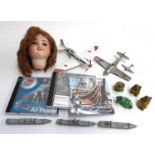 A mixed lot to include an S.F.B.J 60 Paris dolls head, an air signature 1:48 scale mig-3, Dinky