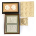 A collection of plaster intaglios and other plaques