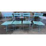 A set of four painted folding metal garden chairs