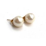 A pair of 9ct gold pearl stud earrings, the pearls approx. 1cmD