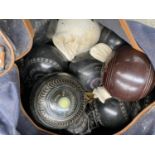 A bag containing fourteen vintage lawn bowls