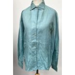 An Emilio Pucci (size 14) blue silk shirt together with a Scherrer boutique (size 42) brown silk