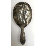 A silver backed looking glass, chased with five putti, London 1908