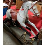 A Ragamuffin Toys Ltd galloping rocking horse, with a grey painted fibreglass leaping horse body