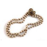 A Miriam Haskell two strand faux baroque pearl necklace, the clasp marked, overall 40cm long