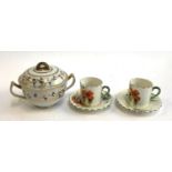 A pair of Britannia Pottery 'Scotch Ivory' c1920s coffee cups & saucers decorated with red &
