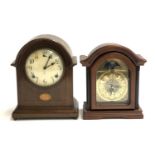 An early 20th century domed mahogany mantel clock, 29cmH; together with one other later