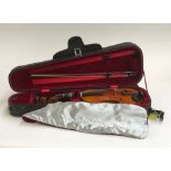 A good 1/4 size student violin, with red velour lined carry case