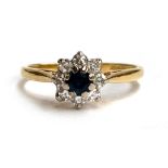 An 18ct gold sapphire and diamond floral cluster ring, size M, 2.5g