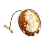 An early 20th century 9ct gold shell cameo brooch, 4.5cm long, with safety chain, 9ct tab and makers