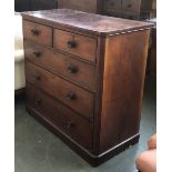 A large Victorian mahogany chest of two short over three graduating drawers, with concave turned