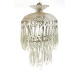 A two tier glass drop chandelier, some losses, approx. 32cmL