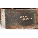 A black painted wooden travel trunk, white script reading 'H. Sims, Shpt 247.CM', the interior