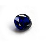 An unmounted inky blue oval cut sapphire, 1x0.8x0.5, 0.75g, approx. 3ct