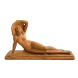 A terracotta figure of a reclining nude, signed S Melani, numbered 676, 68cmW