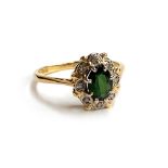 An 18ct gold green tourmaline and diamond cluster ring, size O 1/2, 3.2g