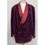 A gent's double breasted smoking jacket with shawl collar and turned cuffs in plum velvet with