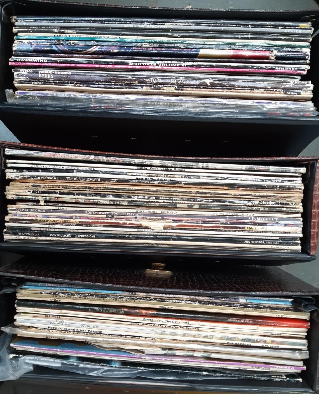 A quantity of vinyl LP's to include Rod Stewart, Bob Dylan, Status Quo, Bon Jovi, Genesis, Black